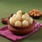 Napkin delight Rasgulla, a famous Bengali sweet in a clay bowl