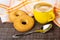 Napkin, shortbread rings with sesame, espresso in cup, spoon on mat