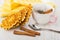 Napkin, waffles, cup with cinnamon, tea bag, spoon on table