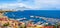 Naples city and port with Mount Vesuvius on the horizon seen from the hills of Posilipo. Seaside landscape of the city harbor and