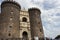 Naples, Italy - 13/06/2018: Castel-Nuovo fortress against blue sky. Italian medieval architecture.
