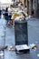 Naples, Italy - August 15, 2019: Overloaded trash can in Naples hitoric city center in summer