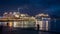 NAPLES, ITALY - NOV 5, 2018: Big white Costa Fascinosa cruise ship docked at the port of Naples at night