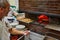 Naples, Italy - October 24, 2019: L\\\'Antica Pizzeria da Michele. Naples, Italy. Man making Neopolitan pizza in a