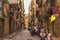 NAPLES, ITALY - OCTOBER 31, 2015: One of the old shabby narrow streets in the historical part.