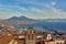 Naples, Italy: Panoramic view of the city and port with Mount Vesuvius on the horizon as seen from the hills of Posilipo