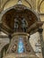 Naples, Italy - September 28, 2023: Part of the baptismal font with Jesus and John the Baptist pointing upwards to the Holy Spirit