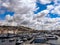 Naples port, fishing boats and yachts on the Mediterranean sea shore