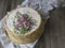 Napoleon cake with vanilla cream, decorated with buttercream flowers. Vintage style. Wooden background, lace napkin. Copy space, c