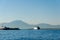 Napoli,Campania/Italy-July 17, 2019: Ferry Caremar leaving a port of Naples on mountains background.