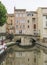 Narbonne, France and the Canal de la Robine. Houses on bridge