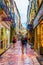 NARBONNE, FRANCE, JUNE 27, 2017: People are strolling through a narrow street in the center of Narbonne, France