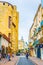 NARBONNE, FRANCE, JUNE 27, 2017: People are strolling through a narrow street in the center of Narbonne, France