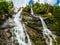 Nardis waterfall in the Adamello Brenta Dolomites park during an outdoor excursion, on a summer day