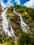 Nardis waterfall in the Adamello Brenta Dolomites park during an outdoor excursion, on a summer day