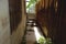 Narrow Alley Between House and Wooden Fence - Vintage Thai Backyard