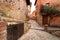 Narrow alley with old stone houses in medieval style in the town of Albarracin, Teruel AragÃ³n