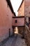 Narrow alley with old stone houses in medieval style in the town of Albarracin, Teruel AragÃ³n