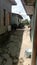 a narrow alleya narrow alley  It is used by the meurandeh people of Langsa Aceh city to cut off the road