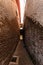 Narrow alleyway alley downtown Urban city parkway orange and red brick super wide angle