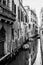 Narrow, ancient and romantic venetian canals. Venice, Italy. Black and white image