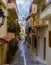 Narrow back streets of a small Greek city near the sea
