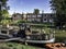 Narrow boat barge under the green trees in Cambridge