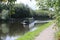 Narrow boat cruising along the Aire and Calder Navigation, a canal in Knottingley West Yorkshire in Britain,UK