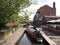 Narrow Boat navigating a lock in the centre of Manchester, England