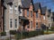 Narrow brick houses with gables