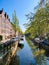 Narrow canal in Amsterdam at spring