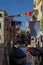 Narrow Canal View with boats in Venice, Italy