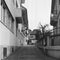 Narrow cobbled streets in the center of Zurich old town, deserted during the lockdown shot with black and white analogue technique