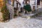 Narrow cobbled streets with flowers in the old village Gourdon,