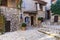 Narrow cobbled streets with flowers in the old village Gourdon,