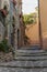 Narrow cobbled streets with flowers in the old village Lyuseram, France