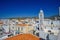 Narrow Cobbled Streets in Tinos island with traditional architectural buildings and local orthodox churches. Tinos, Cyclades