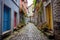 narrow cobblestone alley with colorful doors