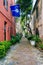 Narrow cobblestone street and old buildings in Charleston, South Carolina