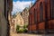 Narrow cobblestone street in old town of Riga city, Latvia. Summer sunny day