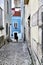 Narrow and colorful streets of Lisbon in a cloudy day