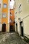 Narrow and colorful streets of Lisbon in a cloudy day