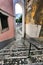 Narrow and colorful streets of Lisbon in a cloudy day