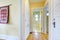 Narrow corridor with white built-ins