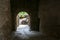 Narrow dark footpath under the houses to a panoramic terrace in Virgoletta, a beautiful ancient mountain village, district of