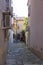 Narrow dark street in the city of Koper, Slovenia