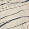 Narrow elongated ridges of snow across the wind. landform background.