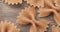 Narrow focus closeup of whole wheat farfalle pasta over wooden table