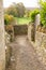 Narrow footpath between cotswold stone walls