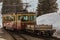 Narrow gauge train in Murren, connecting villages in Lauterbrunnen valley just entering station. A lot of snow around in winter